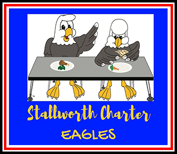 Two mascot eagles eating lunch at table