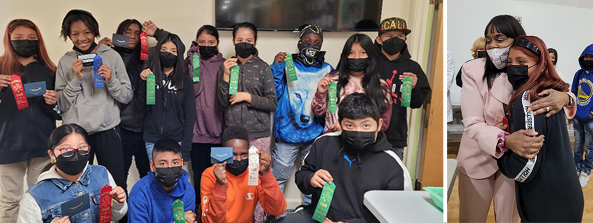 Students posing with award ribbons